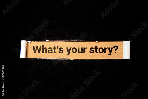 The text What's Your Story appearing behind torn brown paper.