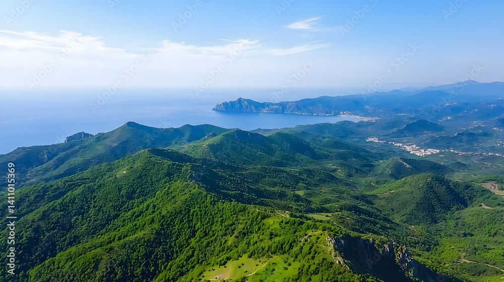High Angle View Of Lush Green Mountains And Coastal Ocean High Angle View Of Lush Green Mountains And Coastal Ocean