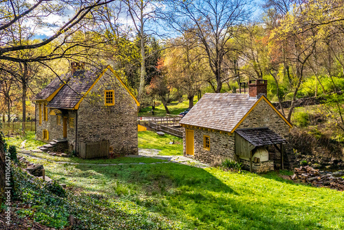 Historic stone homestead at Rittenhousetown in Philadelphia, Pennsylvania, surrounded by spring foliage