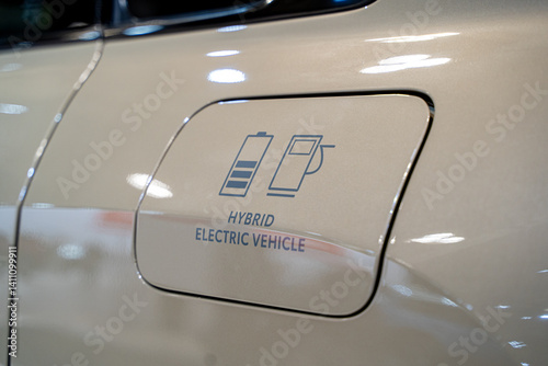 Symbol on the fuel cap of a hybrid electric vehicle.
