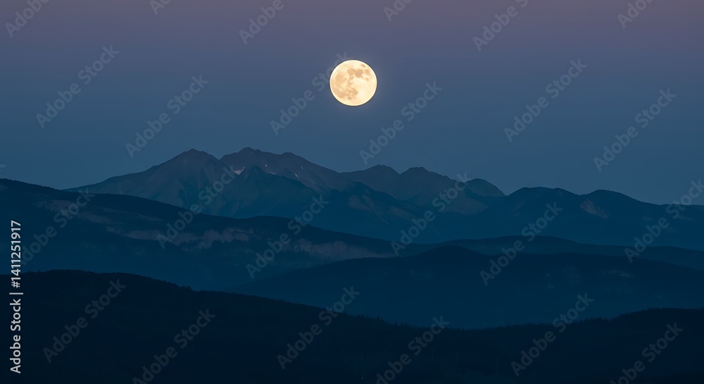Fototapeta premium Serene Full Moon Over Silhouetted Mountain Range