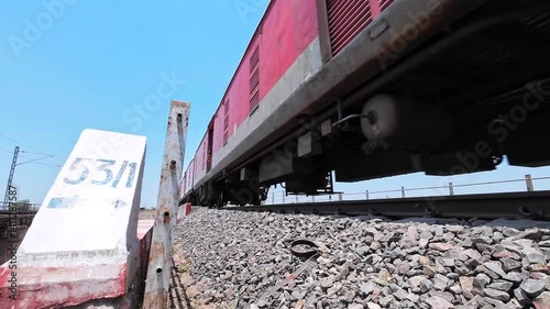 Passenger train hauled by a WAP7 electric locomotive near Pune India.