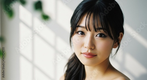 Free Download Portrait of a beautiful young Asian woman with clean skin in natural light - GFXLoad