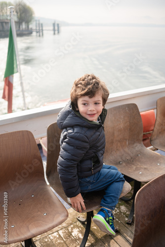 Boy enjoys a relaxing boat ride on calm waters
