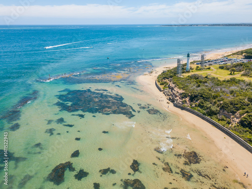 Wallpaper Mural Aerial view of a lighthouse sitting high on a coastal clifftop Torontodigital.ca