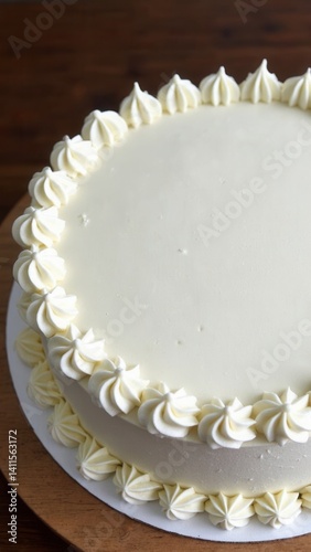 Obraz na płótnie Large white cake with a blank top on a wooden table. w salonie