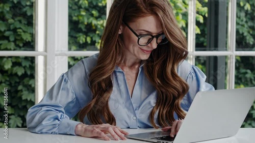 The Woman with Laptop Focused