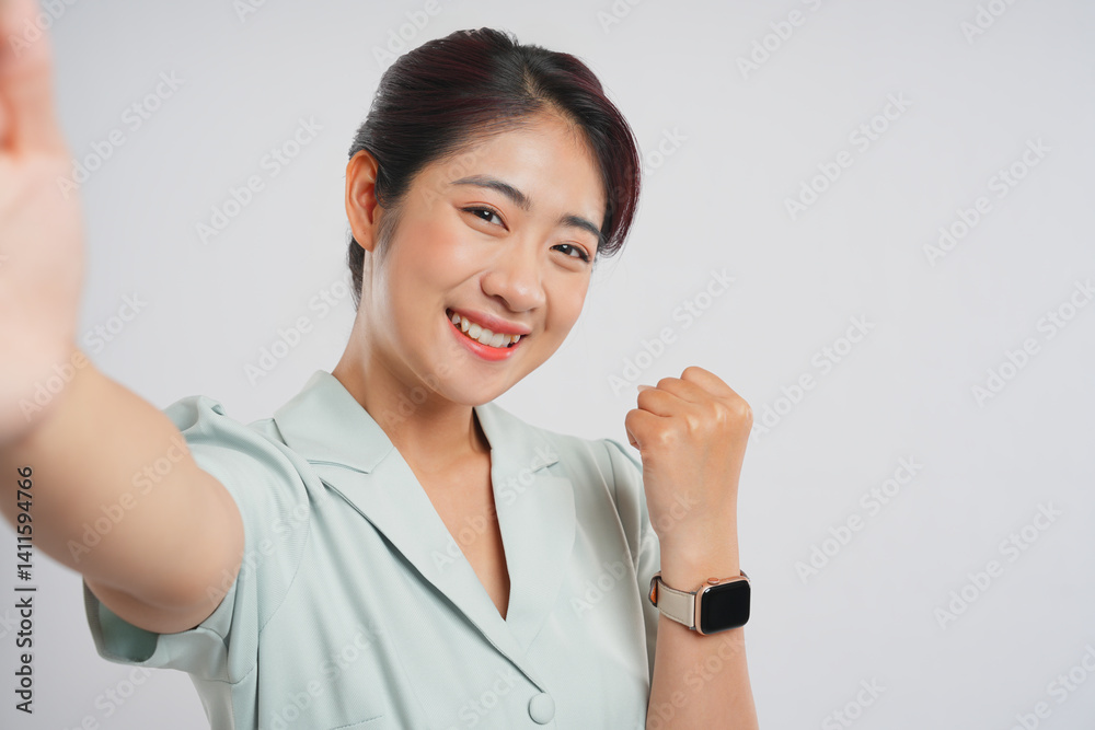 Excited young professional celebrating success with a joyful selfie radiating positivity and triumph Excited young professional celebrating success with a joyful selfie radiating positivity and triumph