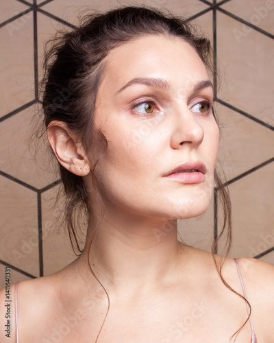 Brown haired person in messy updo