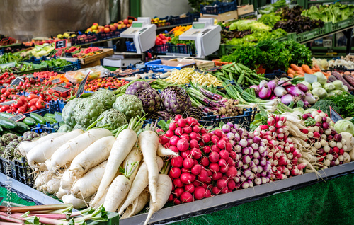 Vibrant display of fresh vegetables at a bustling market in spring showcasing local produce and agricultural abundance