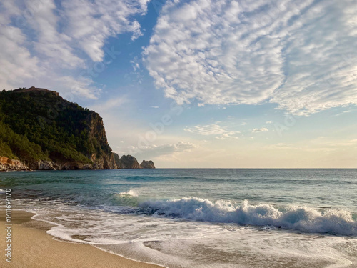 Sunny Shore with Distant Cliff photo