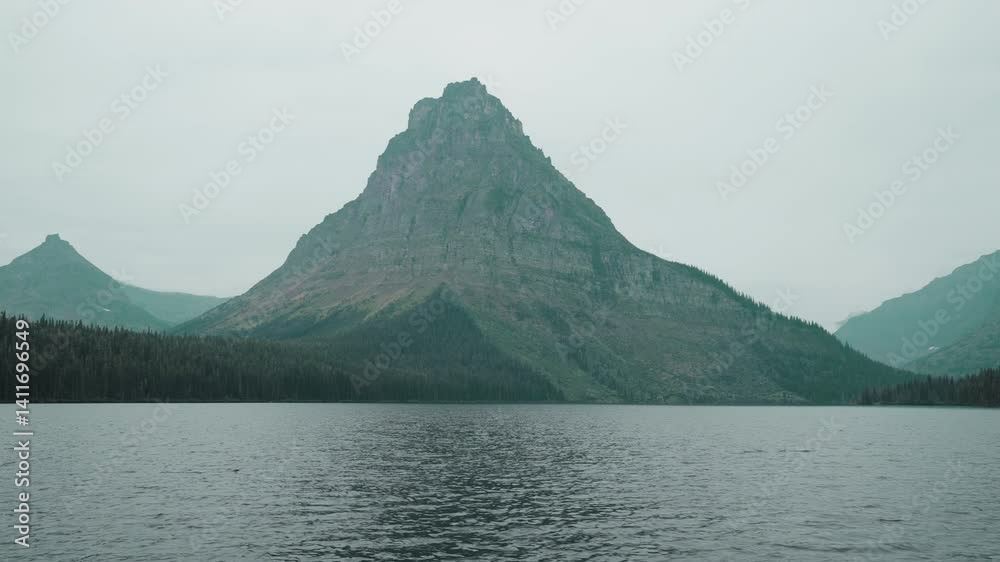 Mountain view across lake, tranquil and moody nature shot in Montana, USA Mountain view across lake, tranquil and moody nature shot in Montana, USA