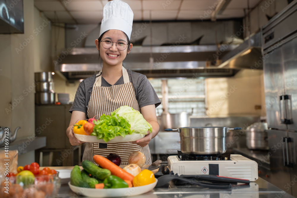 A female chef broadcasts her cooking knowledge live on a social media app on her mobile phone. A female chef broadcasts her cooking knowledge live on a social media app on her mobile phone.