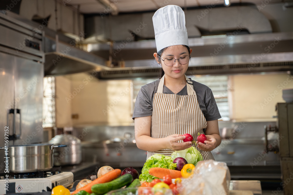 A female chef broadcasts her cooking knowledge live on a social media app on her mobile phone. A female chef broadcasts her cooking knowledge live on a social media app on her mobile phone.