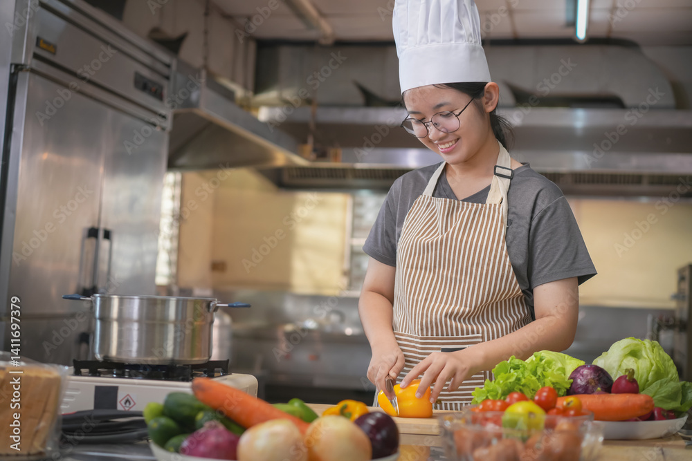A female chef broadcasts her cooking knowledge live on a social media app on her mobile phone. A female chef broadcasts her cooking knowledge live on a social media app on her mobile phone.