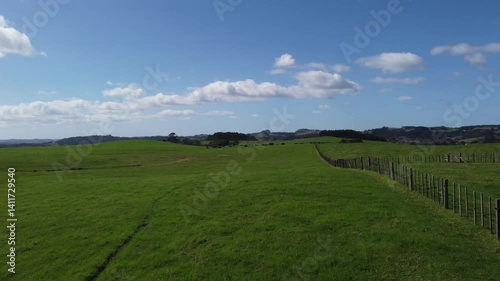 Fenced Farmland in New Zealand Countryside on a Clear Day