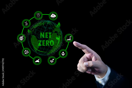 Obraz na płótnie Businessman touching Net Zero icon. natural environment A climate-neutral long-term strategy greenhouse gas emissions targets. concept of carbon neutral and net zero. w salonie
