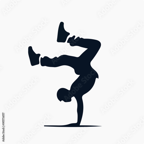 silhouette of a man breakdance