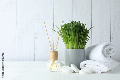 Canvas Print Spa composition with wheatgrass on white table. Space for text