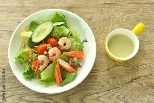 Obraz na płótnie boiled shrimp and crab stick with vegetable seafood salad on plate dressing cream sauce w salonie