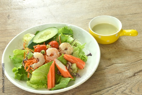Obraz na płótnie boiled shrimp and crab stick with vegetable seafood salad on plate dressing cream sauce w salonie