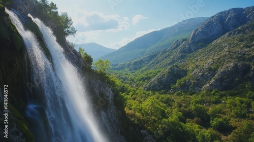 A majestic waterfall cascading down a rugged mountain landscape beautifully