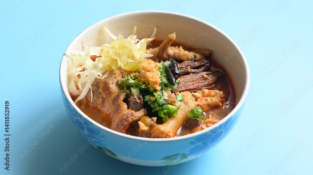 rice vermicelli with northern thai curry sauce on blue background rice vermicelli with northern thai curry sauce on blue background
