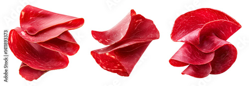 Set of thin slices of cured meat Bresaola with marbled texture isolated on white transparent background, concept of delicacy.