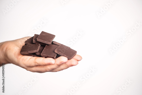 slices of delicious dark chocolate on a light background.
