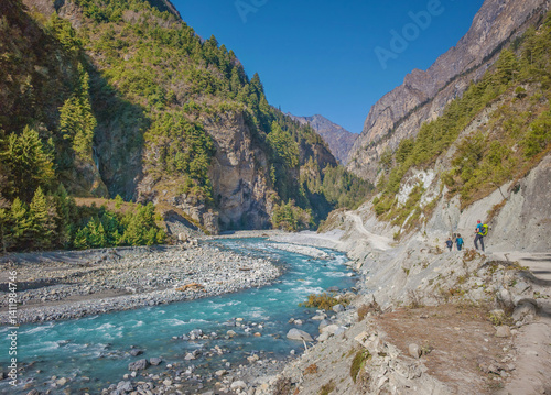 Obraz na płótnie Himalayas, Nepal - The famous hiking on the roof of the world called Annapurna Circuit in the Himalaya range mountain, with little village, buddhist stupa and mountains of 8000 meters. w salonie