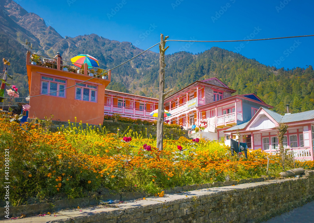 Himalayas, Nepal - The famous hiking on the roof of the world called Annapurna Circuit in the Himalaya range mountain, with little village, buddhist stupa and mountains of 8000 meters.