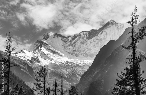 Obraz na płótnie Himalayas, Nepal - The famous hiking on the roof of the world called Annapurna Circuit in the Himalaya range mountain, with little village, buddhist stupa and mountains of 8000 meters. w salonie