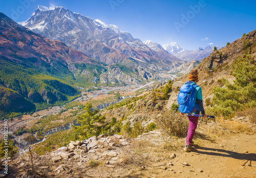 Himalayas, Nepal - The famous hiking on the roof of the world called Annapurna Circuit in the Himalaya range mountain, with little village, buddhist stupa and mountains of 8000 meters.