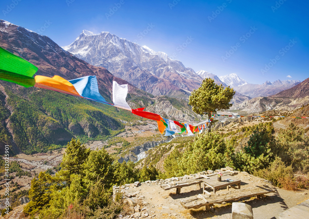 Himalayas, Nepal - The famous hiking on the roof of the world called Annapurna Circuit in the Himalaya range mountain, with little village, buddhist stupa and mountains of 8000 meters.