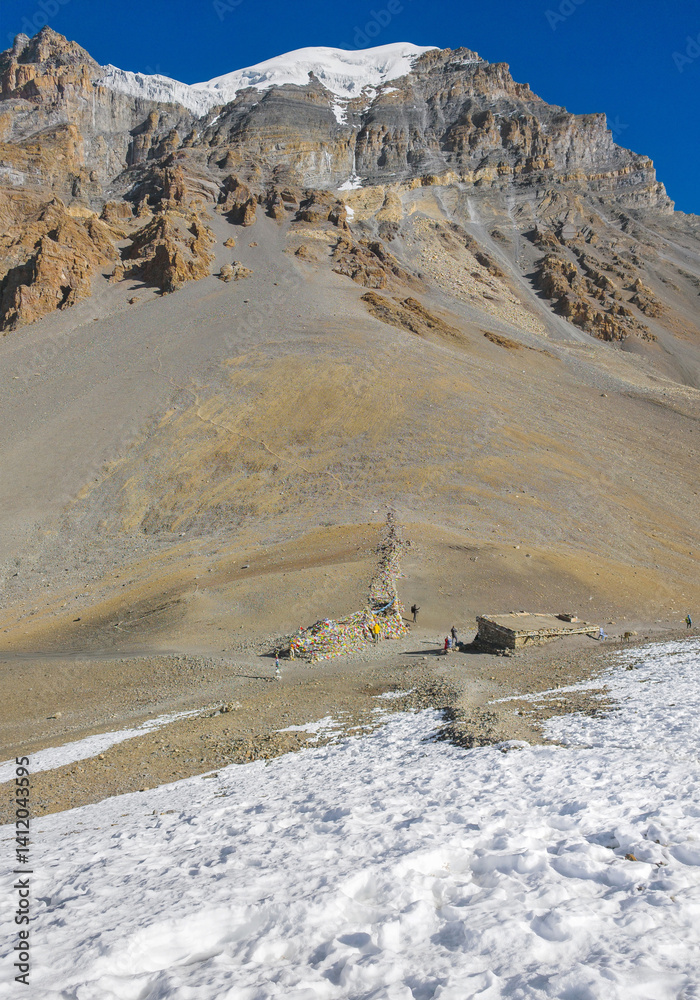 Himalayas, Nepal - The famous hiking on the roof of the world called Annapurna Circuit in the Himalaya range mountain, with little village, buddhist stupa and mountains of 8000 meters.
