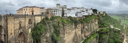 Obraz na płótnie Panoramic view of the town Ronda and the Puente Nuevo bridge over the El Tajo canyon, Andalucía, Spain, March 2024 w salonie