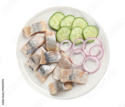 Pieces of delicious herring with onions and cucumber slices isolated on white, top view