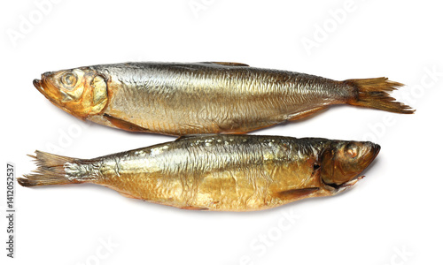 Two tasty smoked herrings on white background, top view