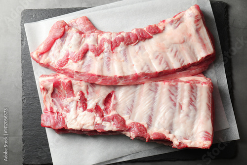 Obraz na płótnie Raw pork ribs on grey table, top view w salonie