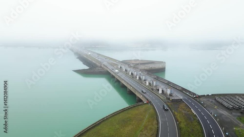 Wallpaper Mural Aerial footage of a dam with traffic and lots of fog over it, France, 4k Torontodigital.ca