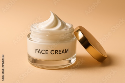 Moisturizing Face Cream in a Glass Jar With Golden Lid on a Soft Brown Backgr...
