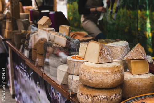 Variety of Cheeses at Market Stall.