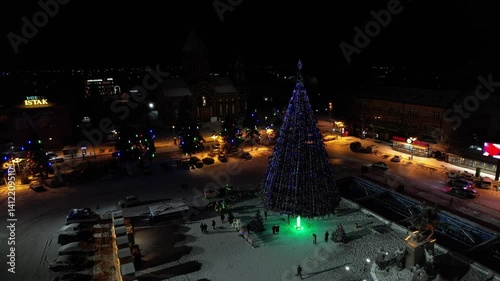 Drone shot of the illuminated Christmas tree at Vardanants Square at night in Gyurmi, Armenia photo
