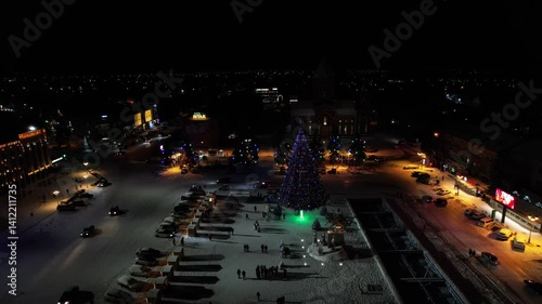 Drone shot of the glowing Christmas tree at night in Vardanants Square, Gyumri, Shirak, Armenia photo