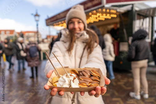 Photography Young woman holds some candy in Amsterdam