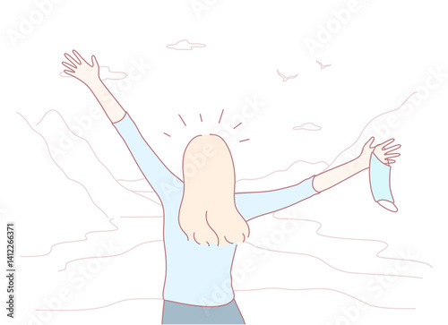 A joyful woman joyfully releases her mask, fully embracing the true beauty of nature and the freedom it offers
