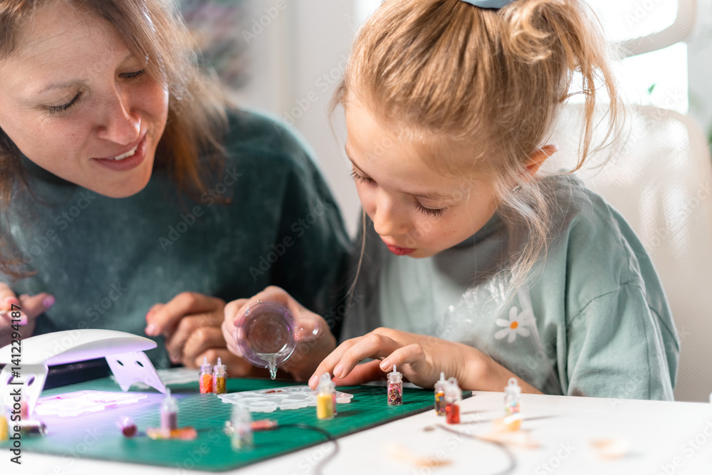 Fototapeta premium Creating handmade resin jewelry with colorful glitter. Detailed process involves pouring, setting, polishing resin pieces, making elegant and unique accessories for fashion enthusiasts and children.