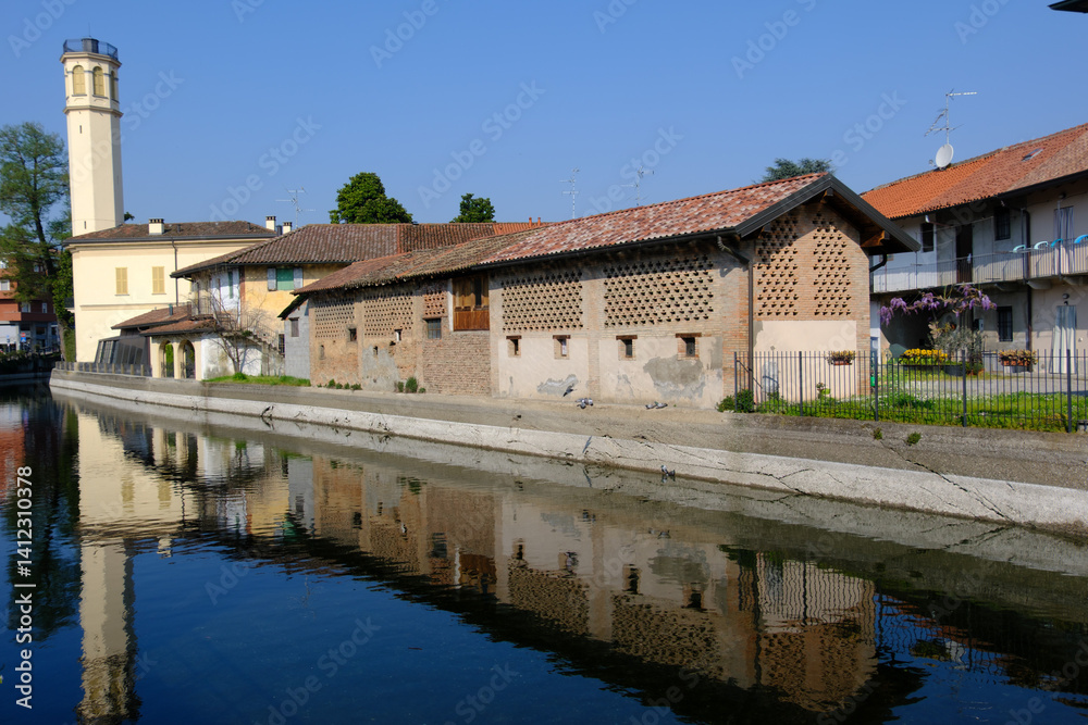Old buildings along the canal Martesana at Inzago, Italy