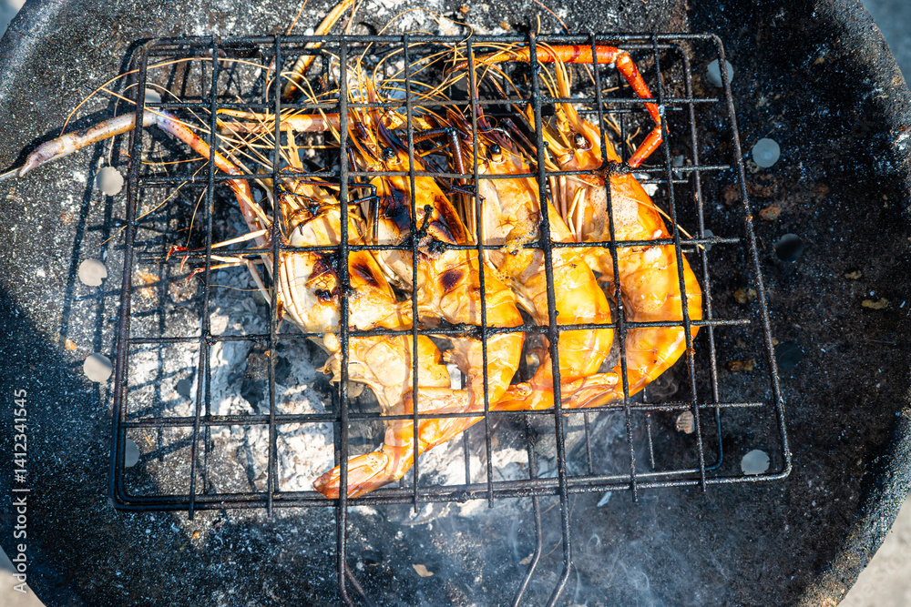 Big river prawn shrimp grilled on fire with smoke