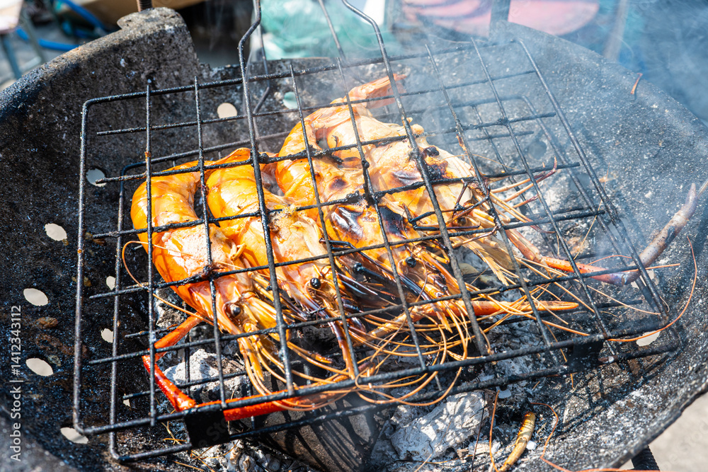 Big river prawn shrimp grilled on fire with smoke